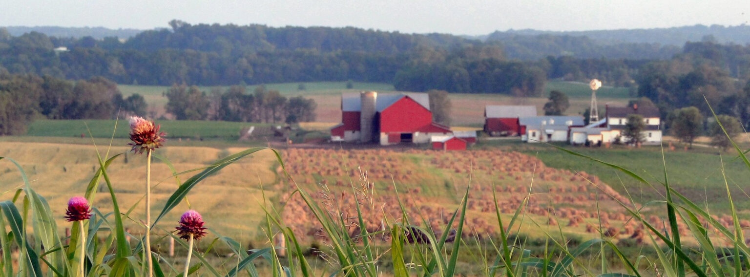 Farm with red barn and fields
